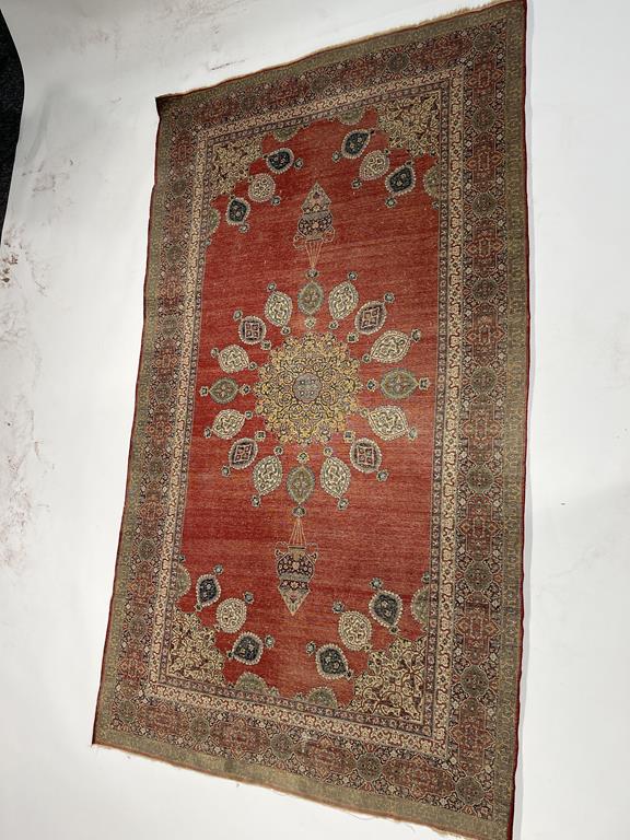 AN ISFAHAN RUG CENTRAL PERSIA, C.1960 the terracotta field of palmettes and scrolling vines enclosed - Image 12 of 26