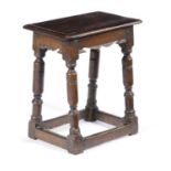 A CHARLES I OAK JOINT STOOL C.1640-50 the seat with a moulded edge above a plain frieze with a