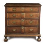 A WILLIAM AND MARY OAK AND WALNUT CHEST LATE 17TH / EARLY 18TH CENTURY with four graduated long