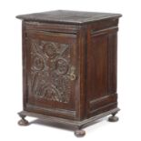 A SMALL OAK CUPBOARD 17TH CENTURY ELEMENTS the hinged door carved with stylised flowers and