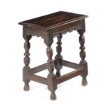 A CHARLES I OAK JOINT STOOL C.1620-30 the seat with a moulded edge, above a moulded frieze within
