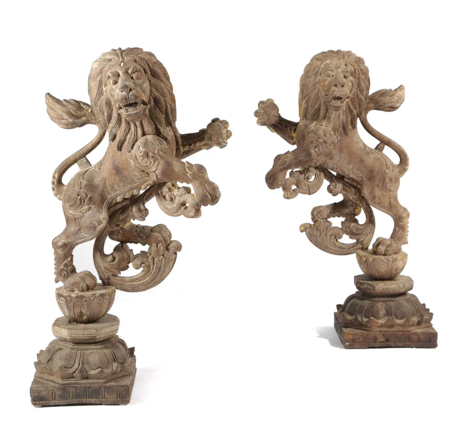 A PAIR OF ANGLO-INDIAN CARVED WOOD HERALDIC LIONS 19TH CENTURY modelled rampant, with scrolling