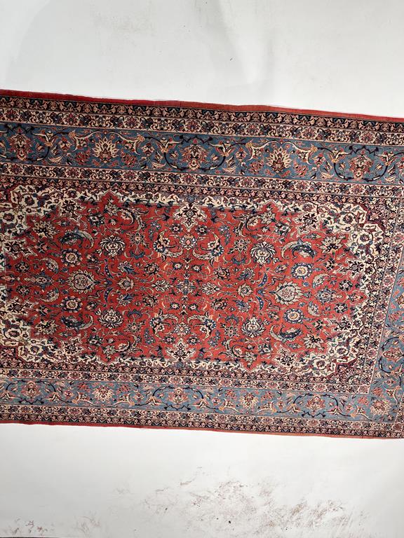 AN ISFAHAN RUG CENTRAL PERSIA, C.1960 the terracotta field of palmettes and scrolling vines enclosed - Image 15 of 26