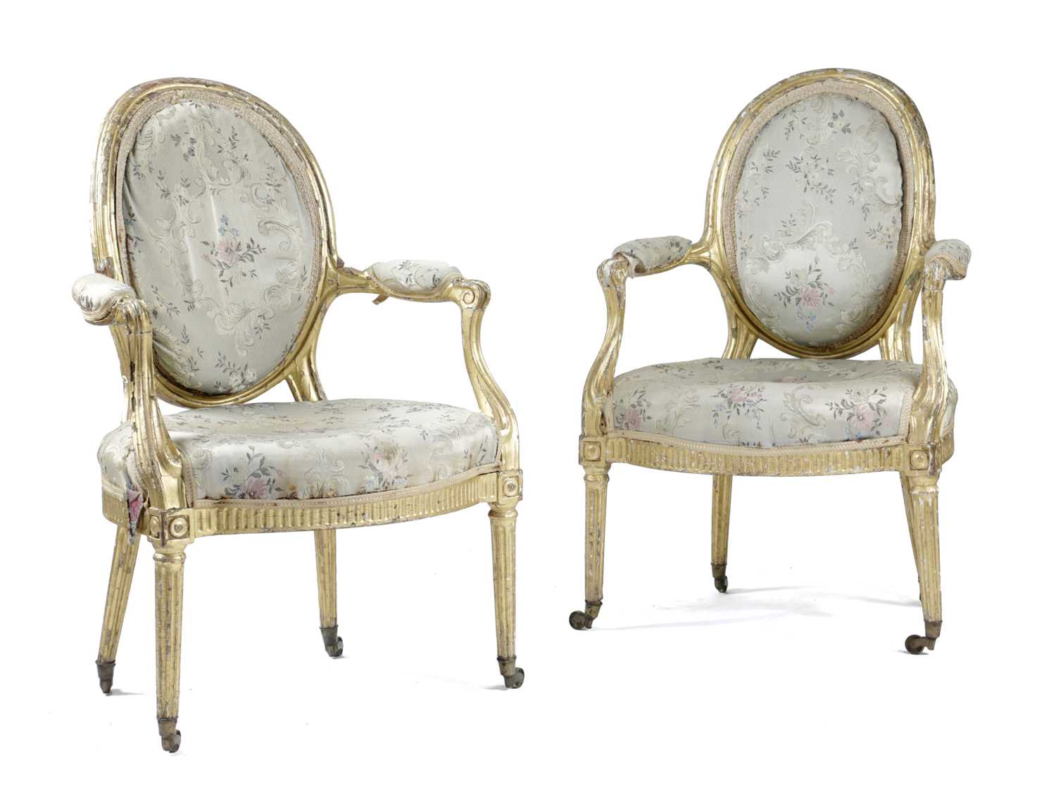 A PAIR OF GEORGE III GILTWOOD OPEN ARMCHAIRS IN THE MANNER OF MAYHEW & INCE, C.1775 each with an