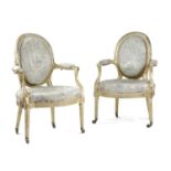 A PAIR OF GEORGE III GILTWOOD OPEN ARMCHAIRS IN THE MANNER OF MAYHEW & INCE, C.1775 each with an