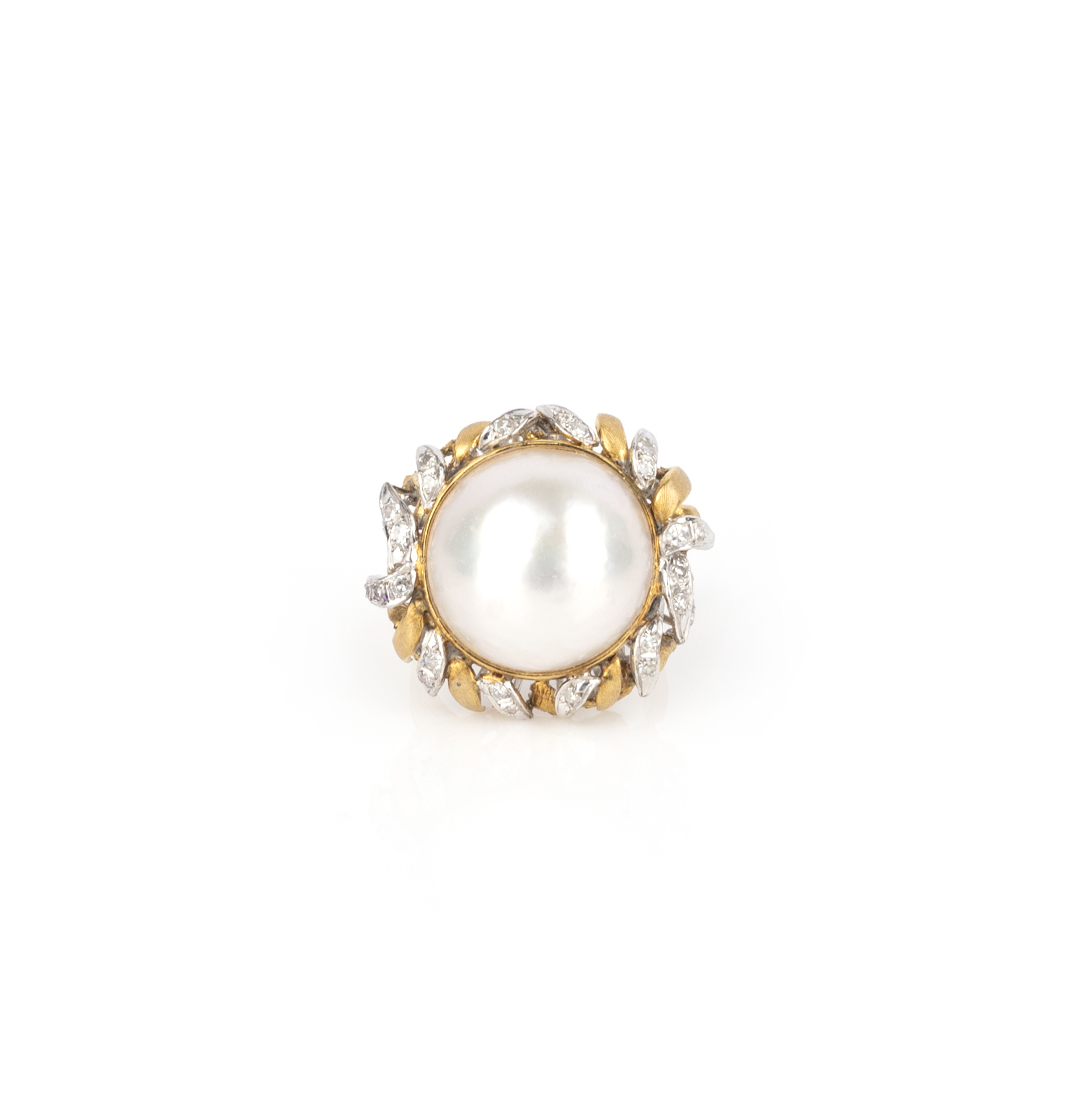 A cultured mabe pearl and diamond dress ring, the cultured pearl set within scrolling yellow gold