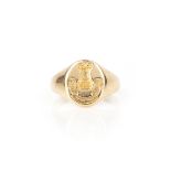 A gold signet ring, engraved with the arms of the de Havilland family, depicting a tower over a