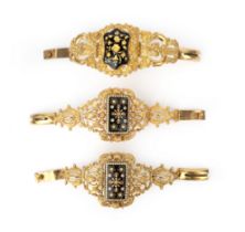 Three enamel and gilt metal bracelets, mid 19th century, comprising: a pair of bracelets and one