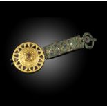 An 8th century Caucasian/Bulgarian bronze belt buckle, circular and probably centred with a