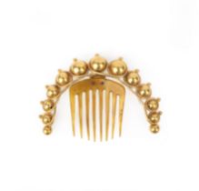 λ A gilt metal and tortoiseshell hair ornament, mid 19th century, the headband designed as coiled