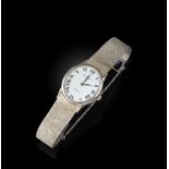 Baume & Mercier, a gentleman's white gold 'Baumatic' wristwatch, the oval white dial with black
