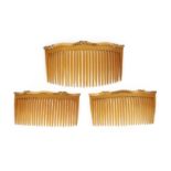 λ A set of three French gold and tortoiseshell haircombs, 19th century, each with an undulating gold