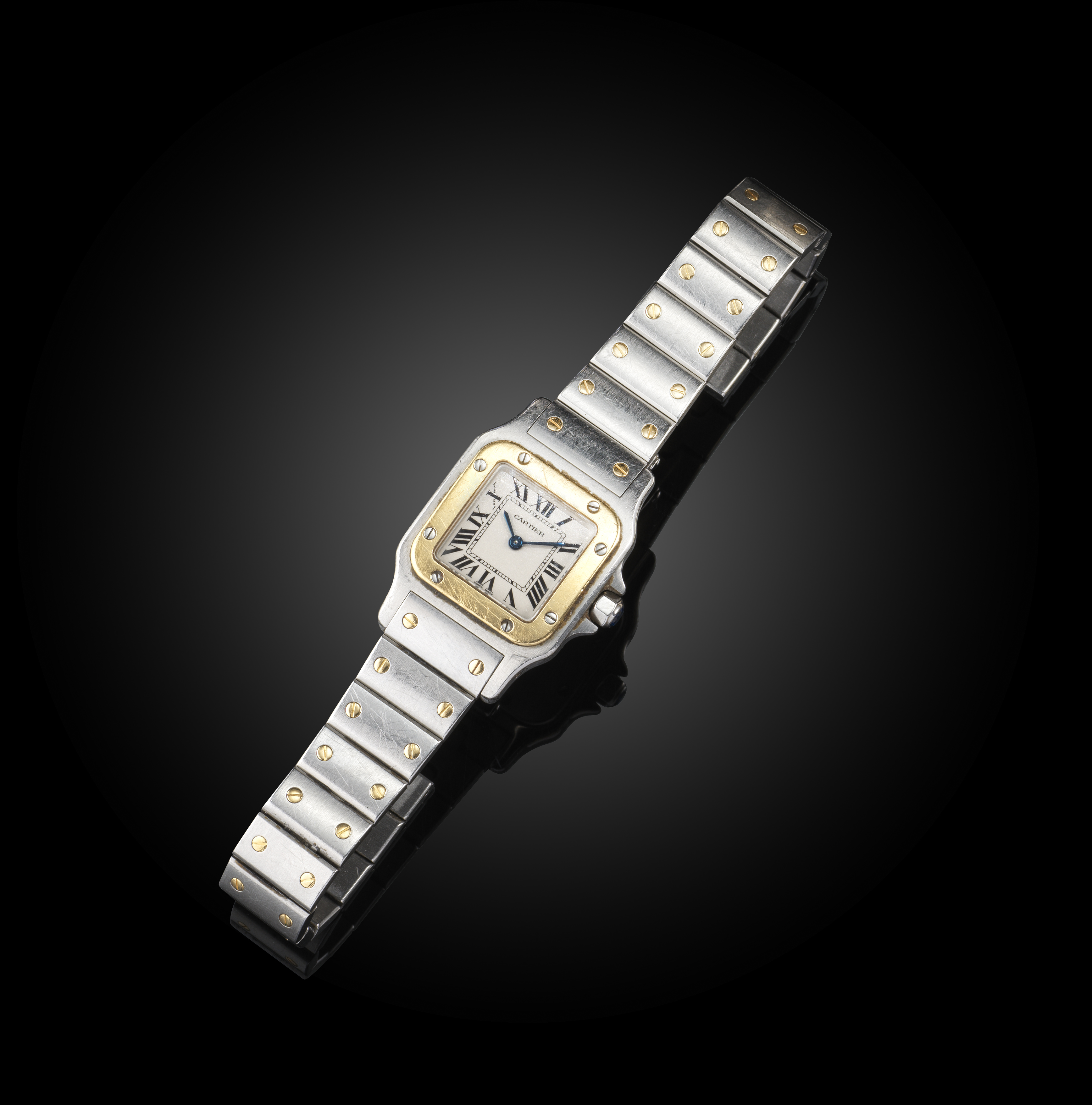 Cartier, a stainless steel 'Santos' wristwatch, the square white enamel dial with Roman numeral