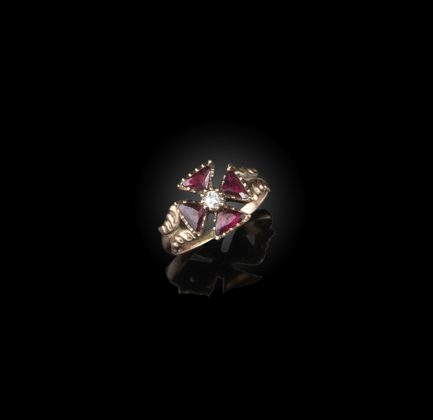 A George III garnet and diamond ring, circa 1800, designed as a Maltese cross, composed of