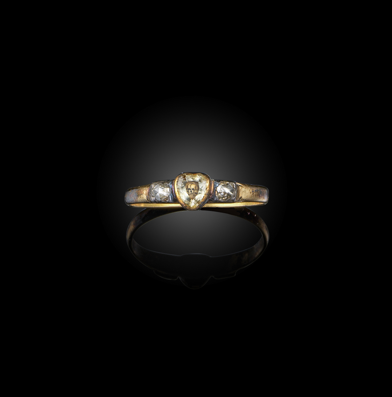 A Stuart crystal and diamond mourning ring, circa 1700, set with a pear-shaped citrine over a