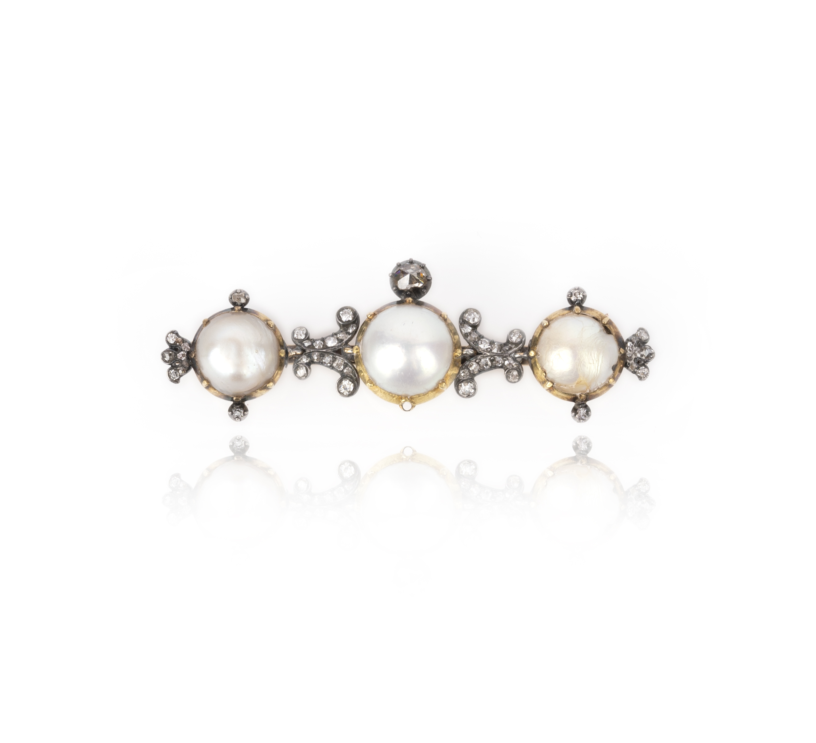 A pearl and diamond brooch, late 19th century, of bar design, set with three half pearls in