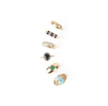 Six gem-set gold rings, including an emerald solitaire ring, a sapphire and diamond cluster ring,