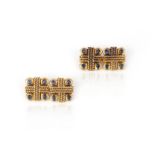 A pair of gold and sapphire cufflinks, each end of square outline with rope twist details, each
