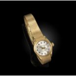 Rolex, a lady's gold Datejust wristwatch, the signed silver dial with baton numerals, date aperture,