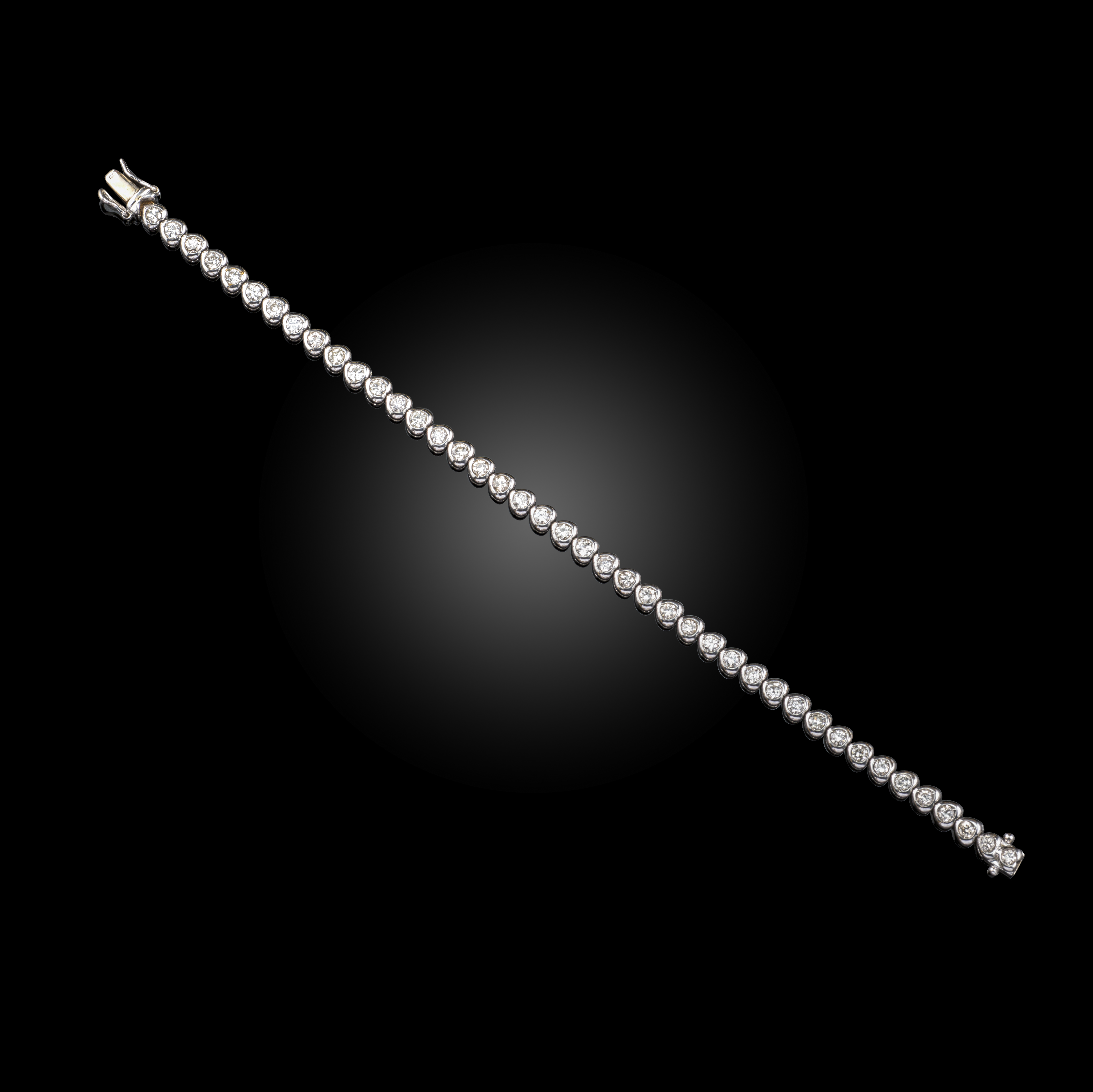 A diamond line bracelet, set with round brilliant-cut diamonds in heart-shaped 18ct white gold