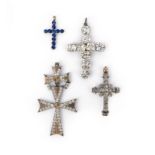 Four cross pendants, including an early 19th century colourless paste cross set in closed-back
