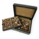 A jewellery box containing a collection of jewellery, comprising: a sapphire and diamond cluster