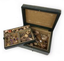 A jewellery box containing a collection of jewellery, comprising: a sapphire and diamond cluster
