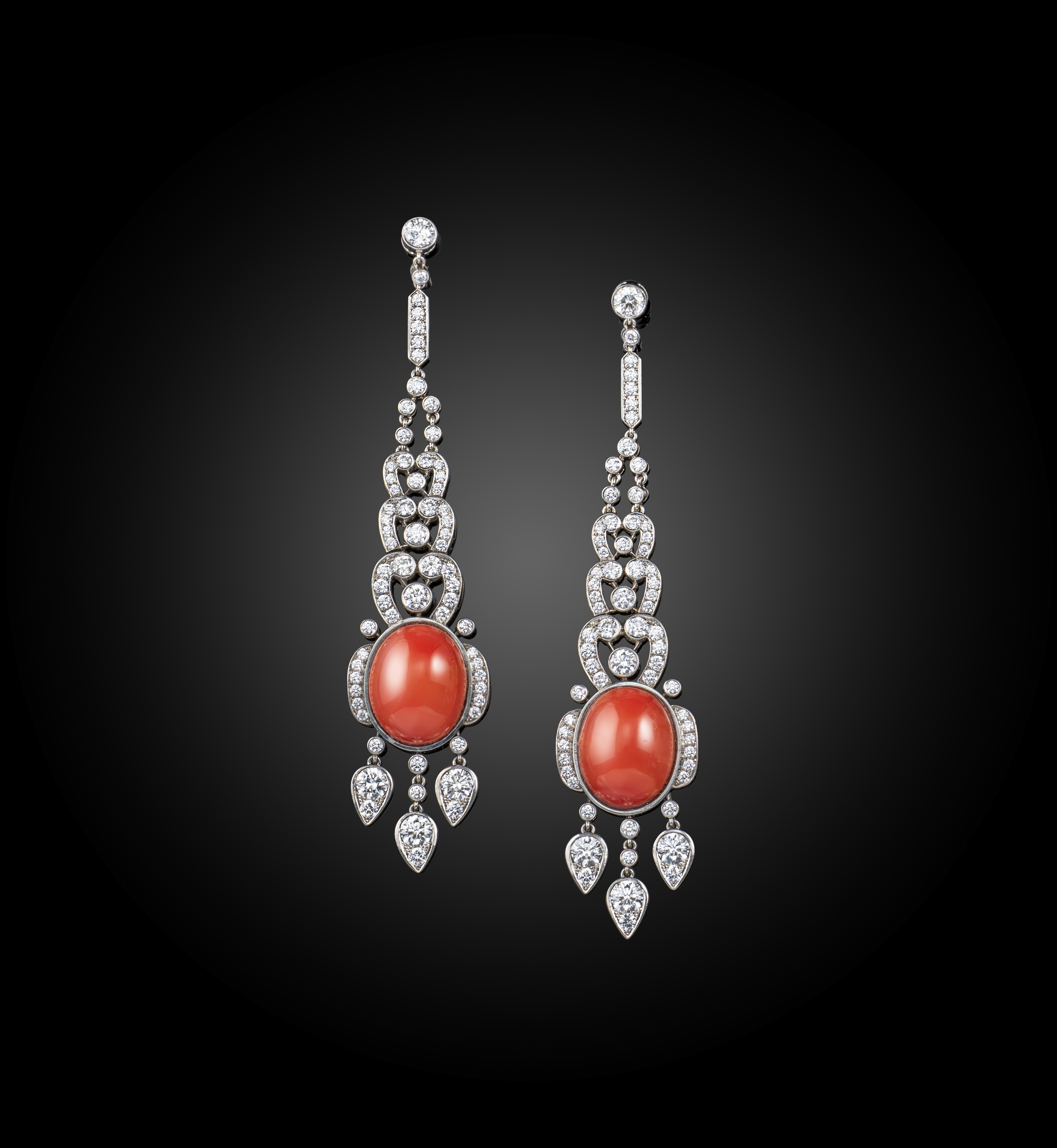 A pair of diamond drop earrings, the openwork designs set with graduated round brilliant-cut