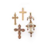 A collection of four cross pendants, 19th century, comprising: three pendants designed as crosses,