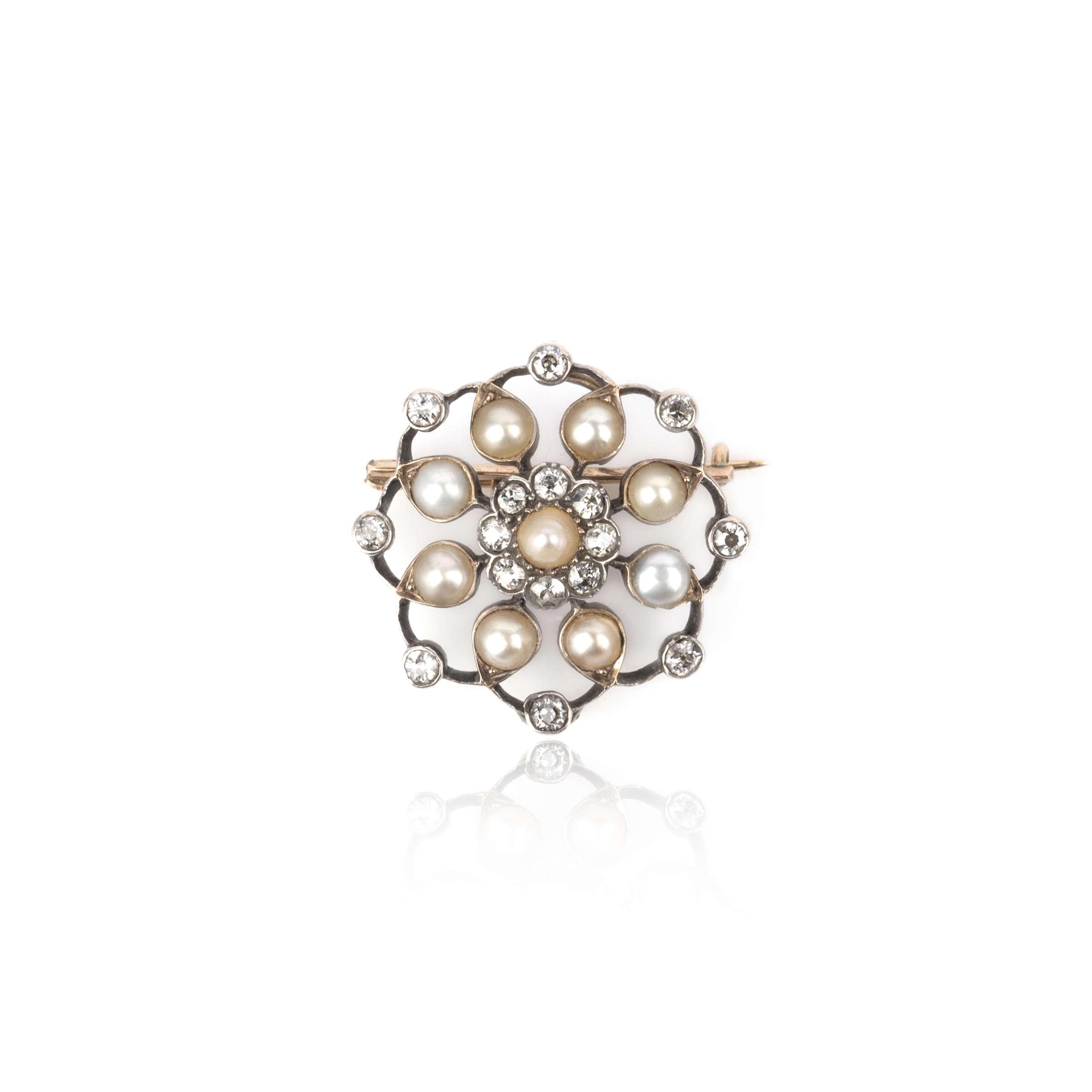 A Victorian diamond and pearl brooch, late 19th century, designed as a stylised flower, of knife