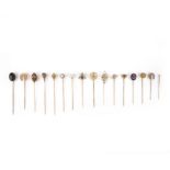 A collection of sixteen stick pins, late 19th and 20th century, comprising: two stick pins set