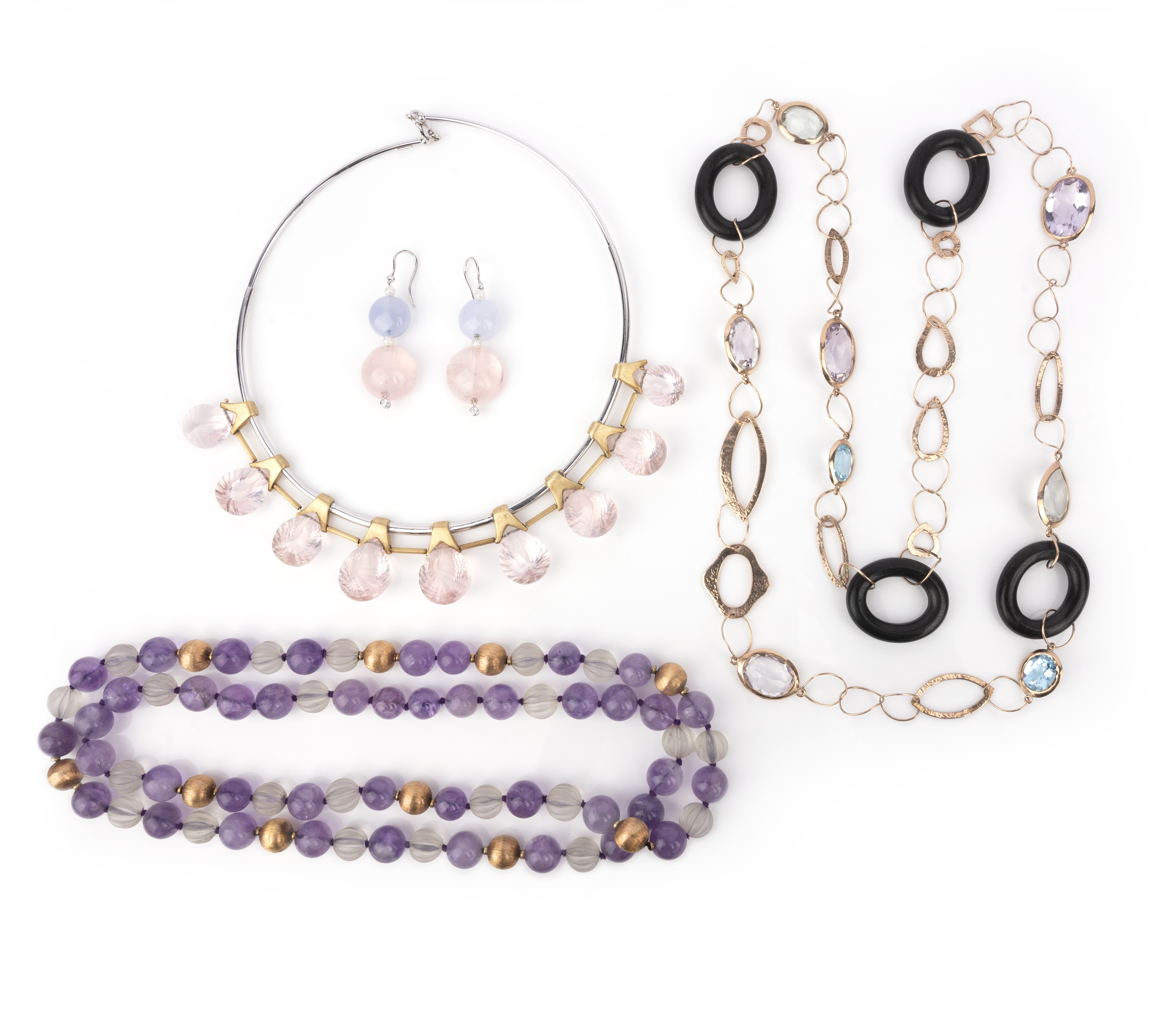A collection of jewellery, comprising: a collar suspending a fringe of pear-shaped rose quartz