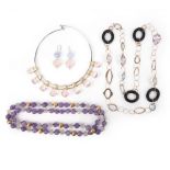 A collection of jewellery, comprising: a collar suspending a fringe of pear-shaped rose quartz