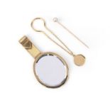 A Cartier keyfob, a hand mirror by Hermès, and a pearl stick pin, comprising: a gold key fob by