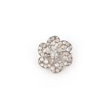 A diamond brooch, late 19th century, designed as a six-petalled flower, set with circular-cut and