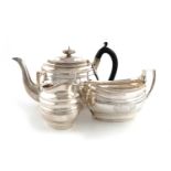 A three-piece George III presentation silver tea set,by Samuel Hennell, London 1801,oval form,