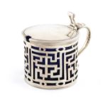 A George III silver mustard pot,by Augustin Le Sage, London 1765,circular form, scroll handle,