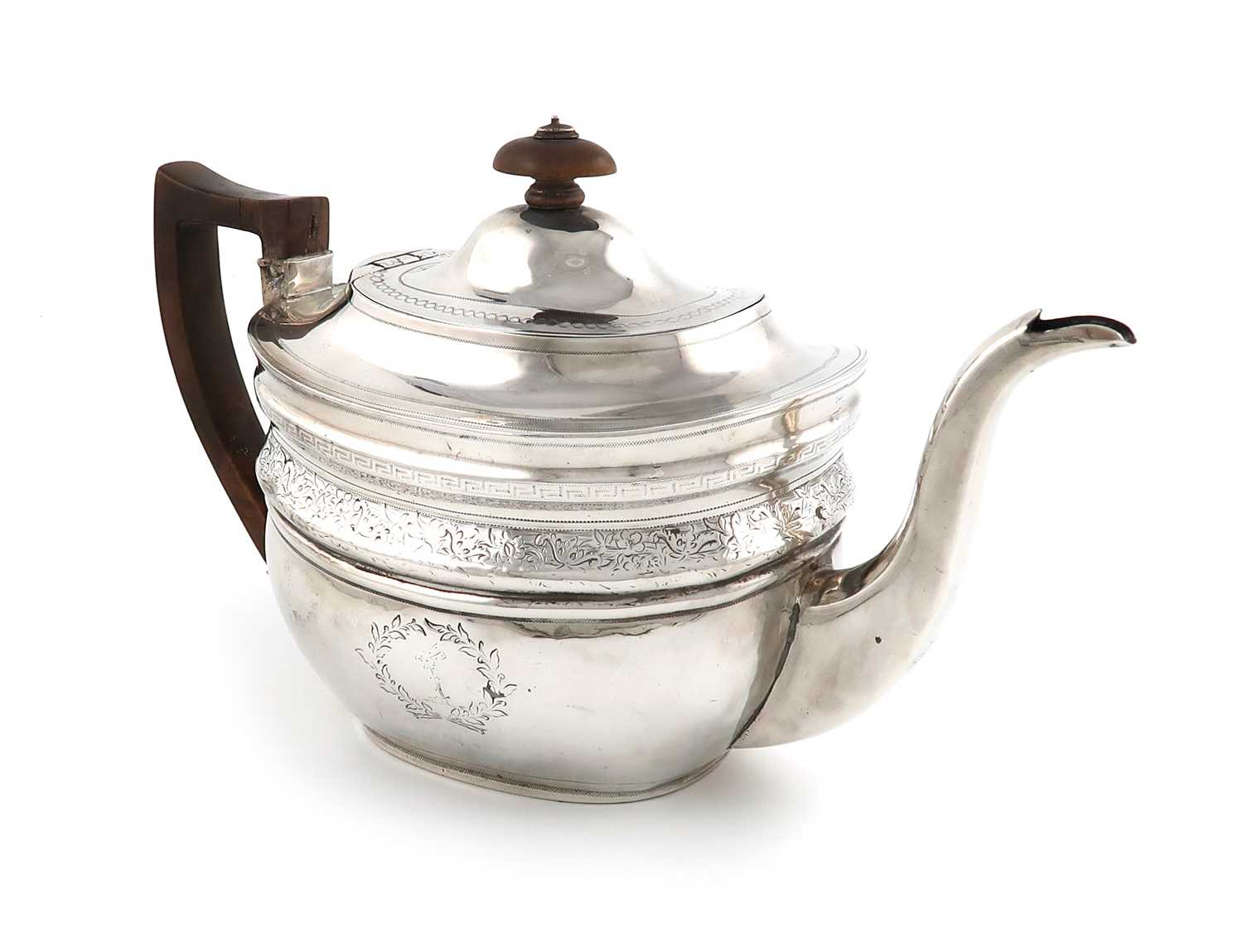 A George III silver teapot,by Thomas Wallis, London 1804,oval form, wooden scroll handle and finial,