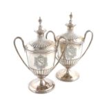 A pair of George III silver two-handled cups and covers,by Henry Chawner, London 1795,vase form,