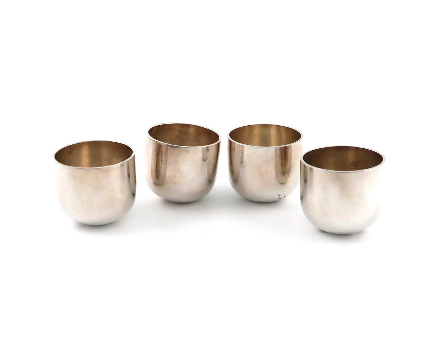 A set of four modern silver tumbler cups,maker's mark of R. Comyns, Birmingham Assay Office,