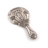 An Art Nouveau silver hand mirror,by William Aitkin, Birmingham 1913,embossed with a maiden within