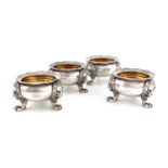 A set of four George IV silver salt cellars,by Robert Garrard, London 1822,circular form, gadroon