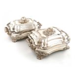 A pair of early 19th century old Sheffield plated entrée dishes, covers and warming bases,