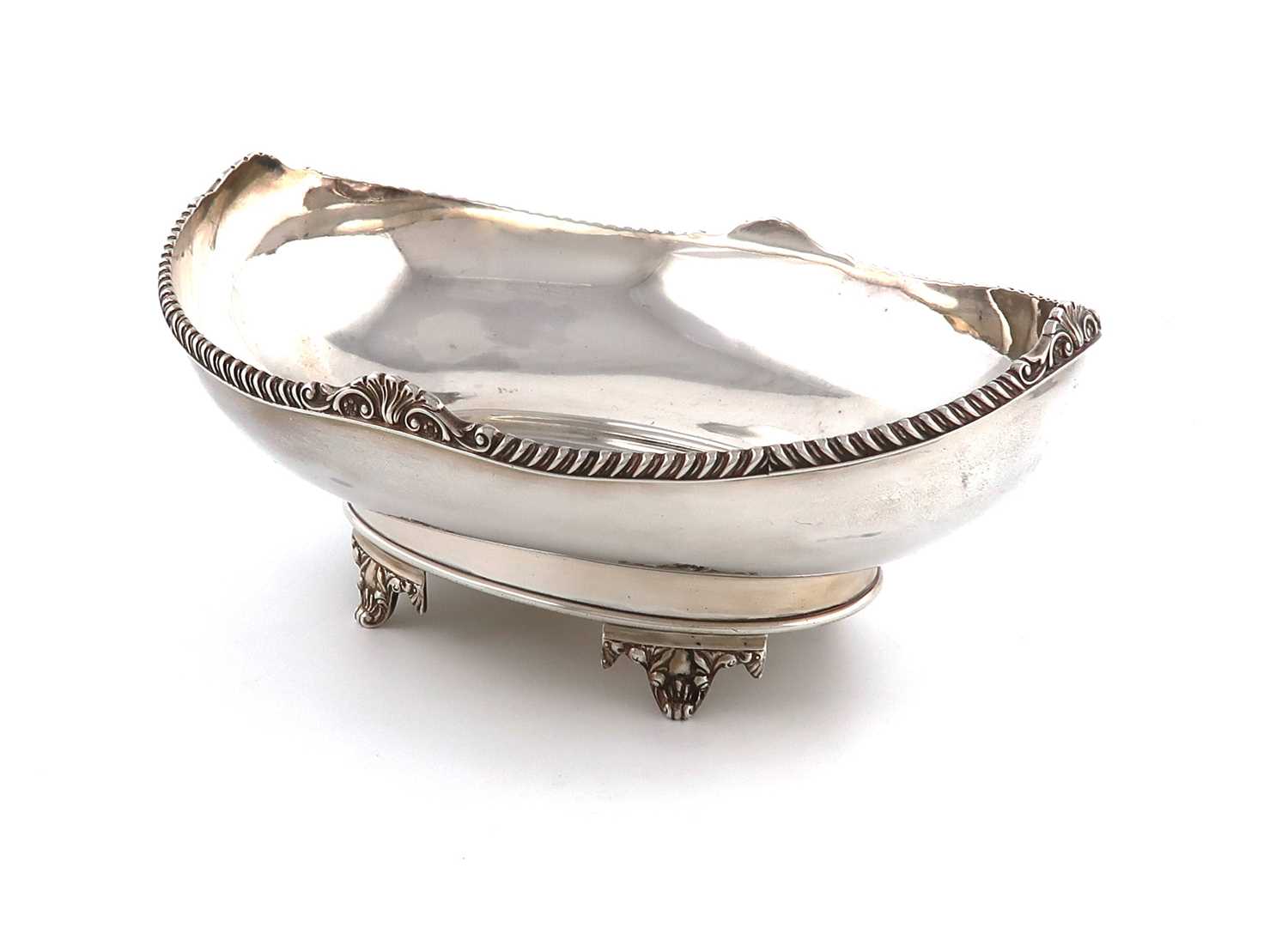 A silver fruit dish,by Mappin & Webb, Sheffield 1928,oval form, gadroon and shell rim, oval base