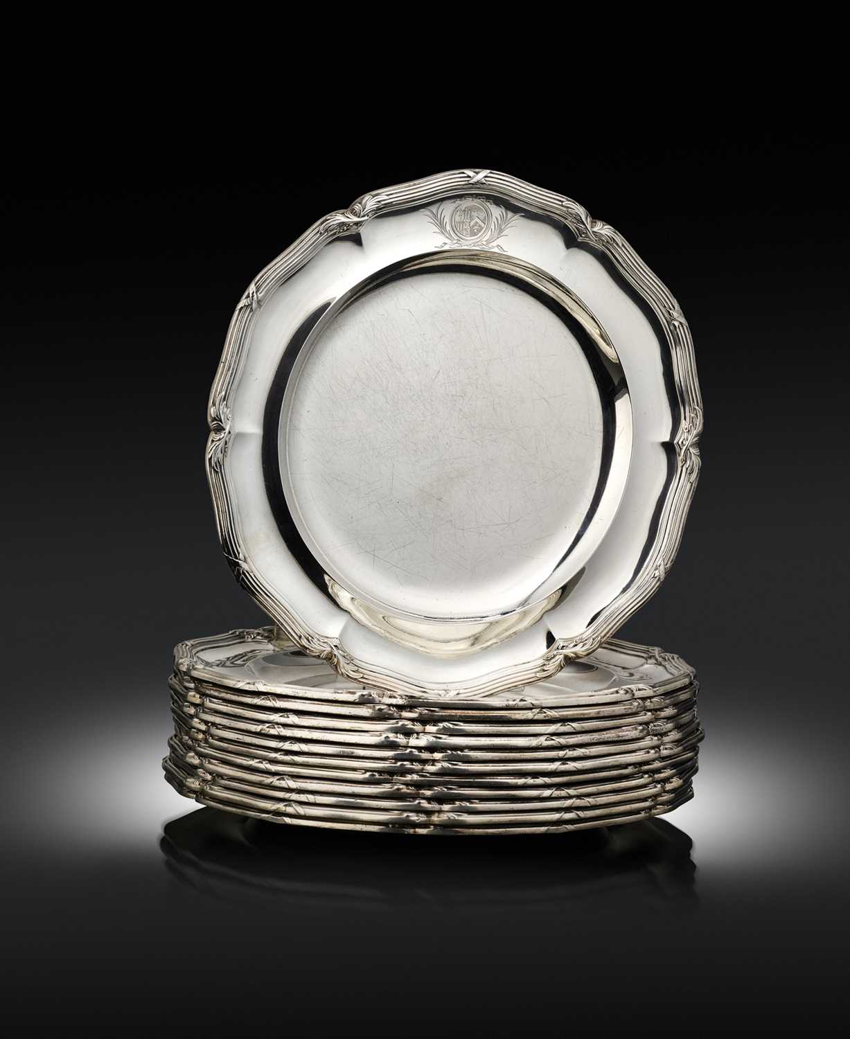 A set of twelve George III silver dinner plates from the Pelham service, by Paul Storr, London