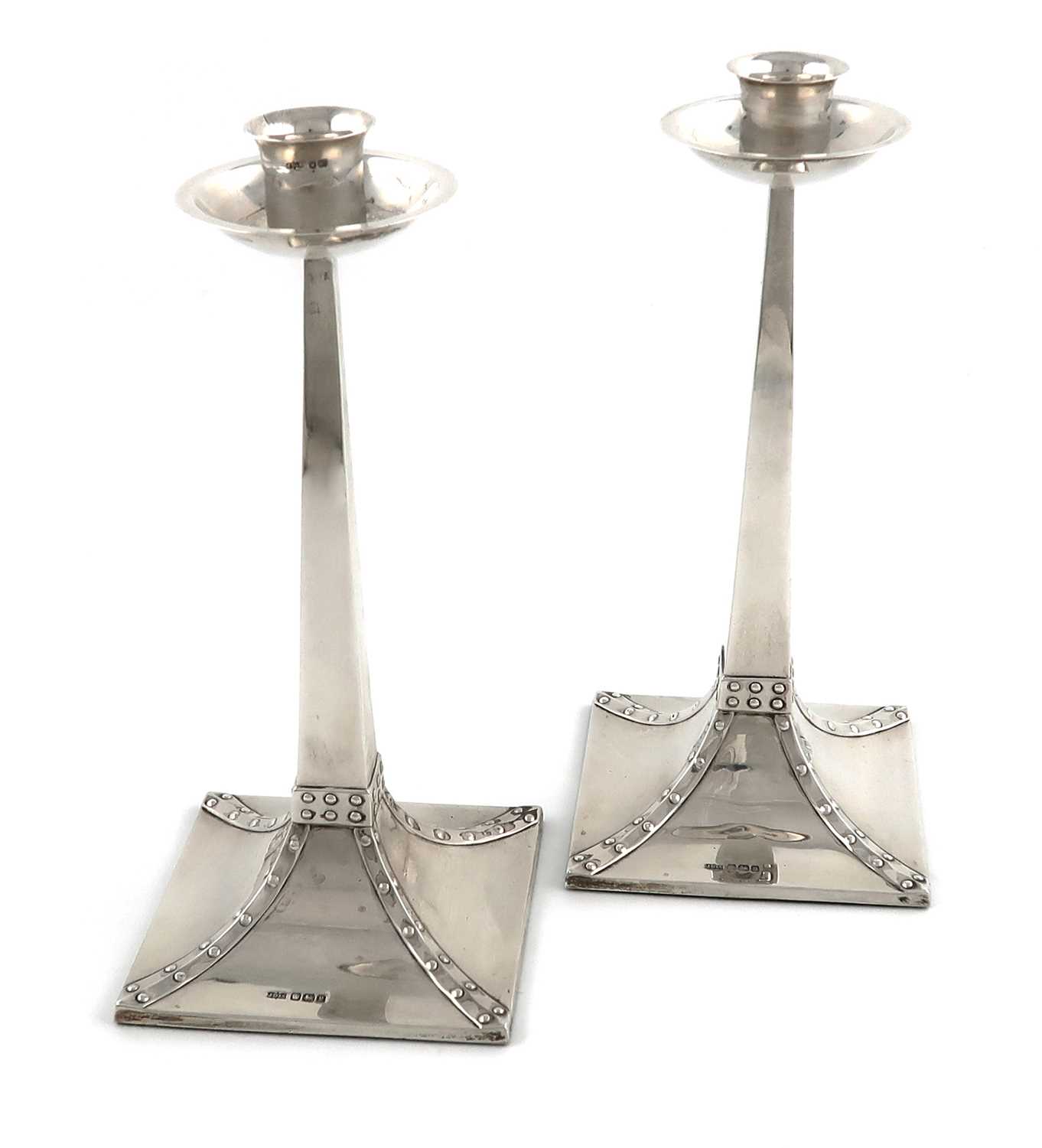 A pair of Arts and Crafts silver candlesticks,by James Dixon and Sons, Sheffield 1916,tapering