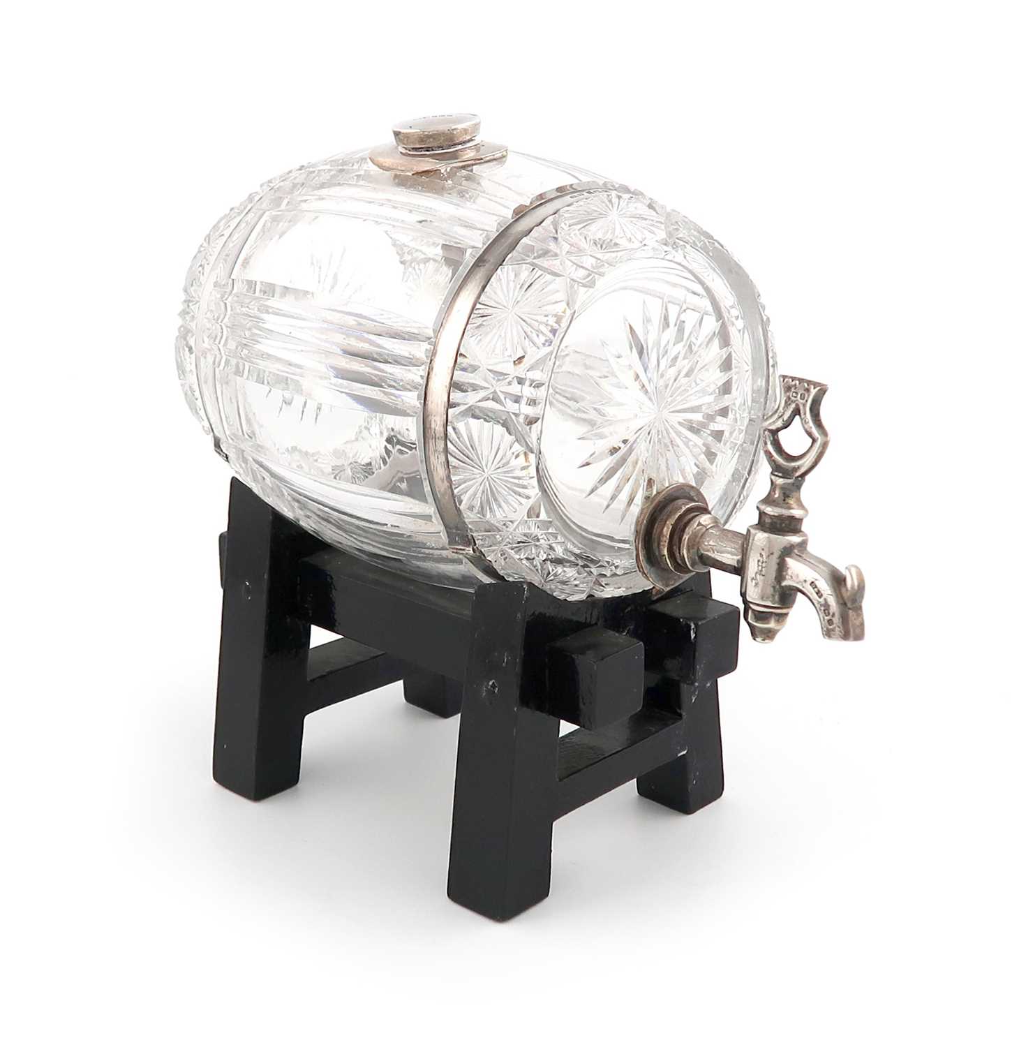 A silver-mounted cut-glass spirit barrel,by Docker and Burn Limited, Birmingham 1927,the barrel with