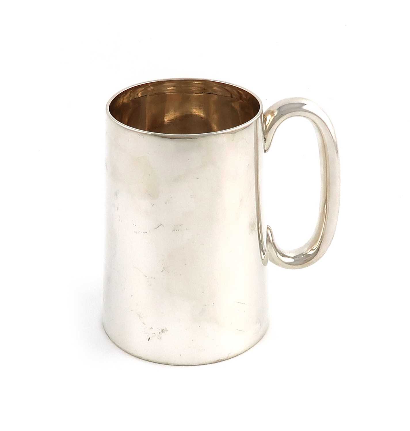 A late-Victorian silver mug,by H. Atkin, Sheffield 1897,tapering circular form, scroll handle,