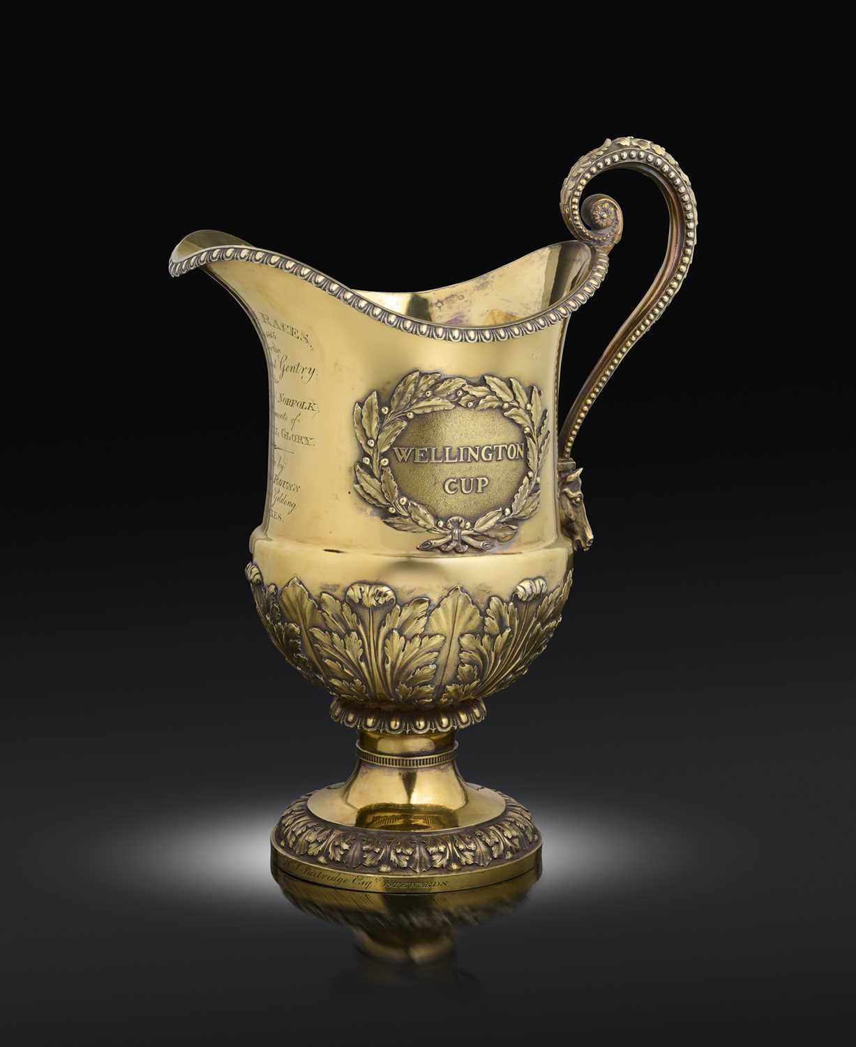 A George III silver-gilt trophy ewer, The Wellington Cup, by John Houle, London 1815,baluster