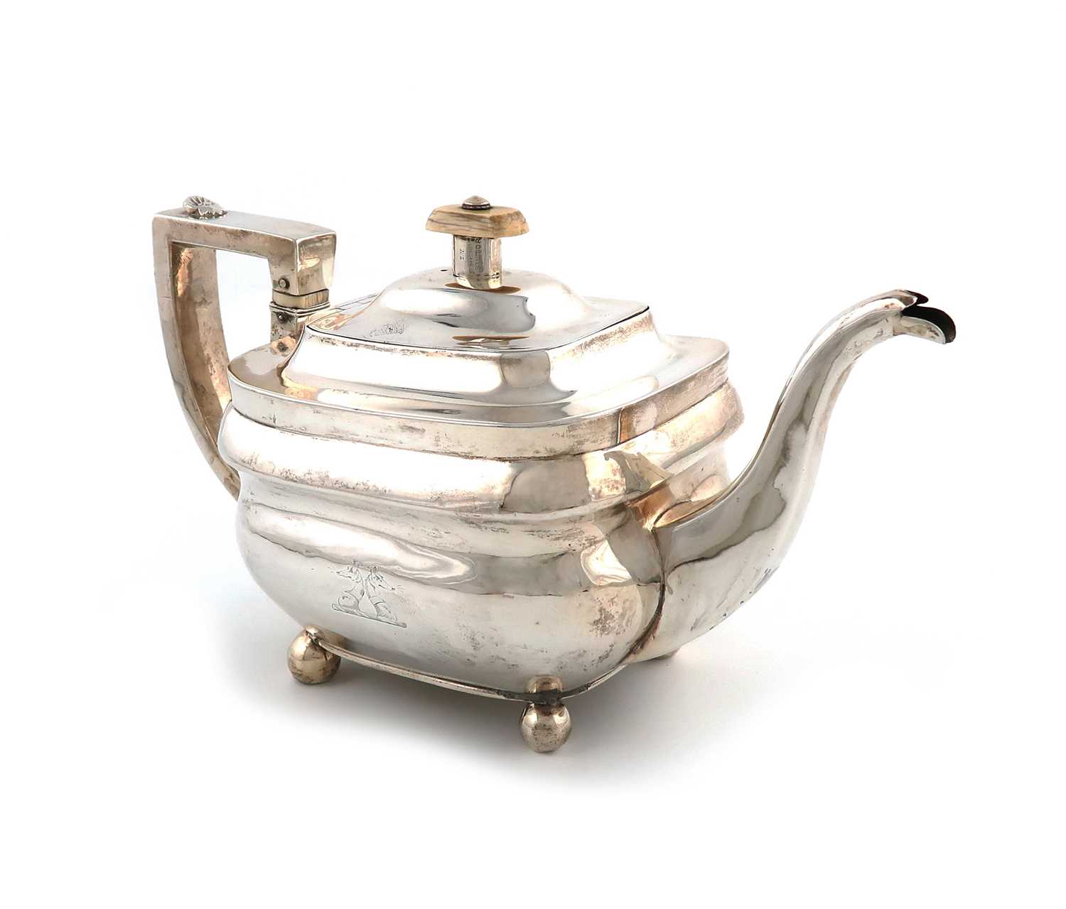 λ λA George III silver teapot,by Naphthali Hart, London 1807,rounded rectangular form, shell-